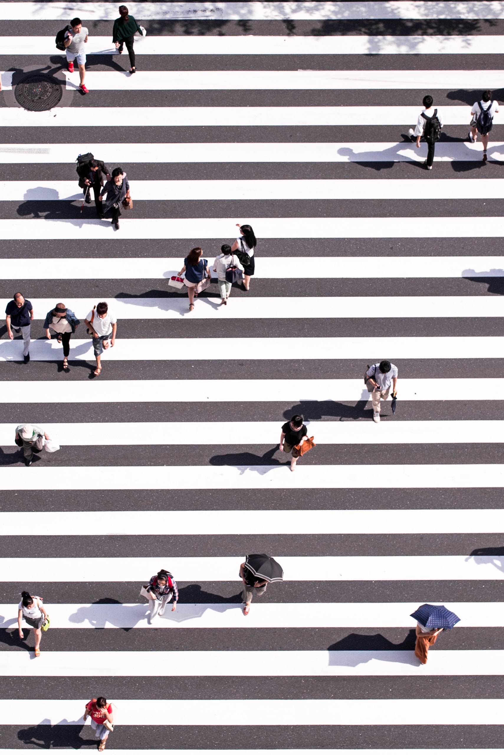 People crossing at a busy intersection
